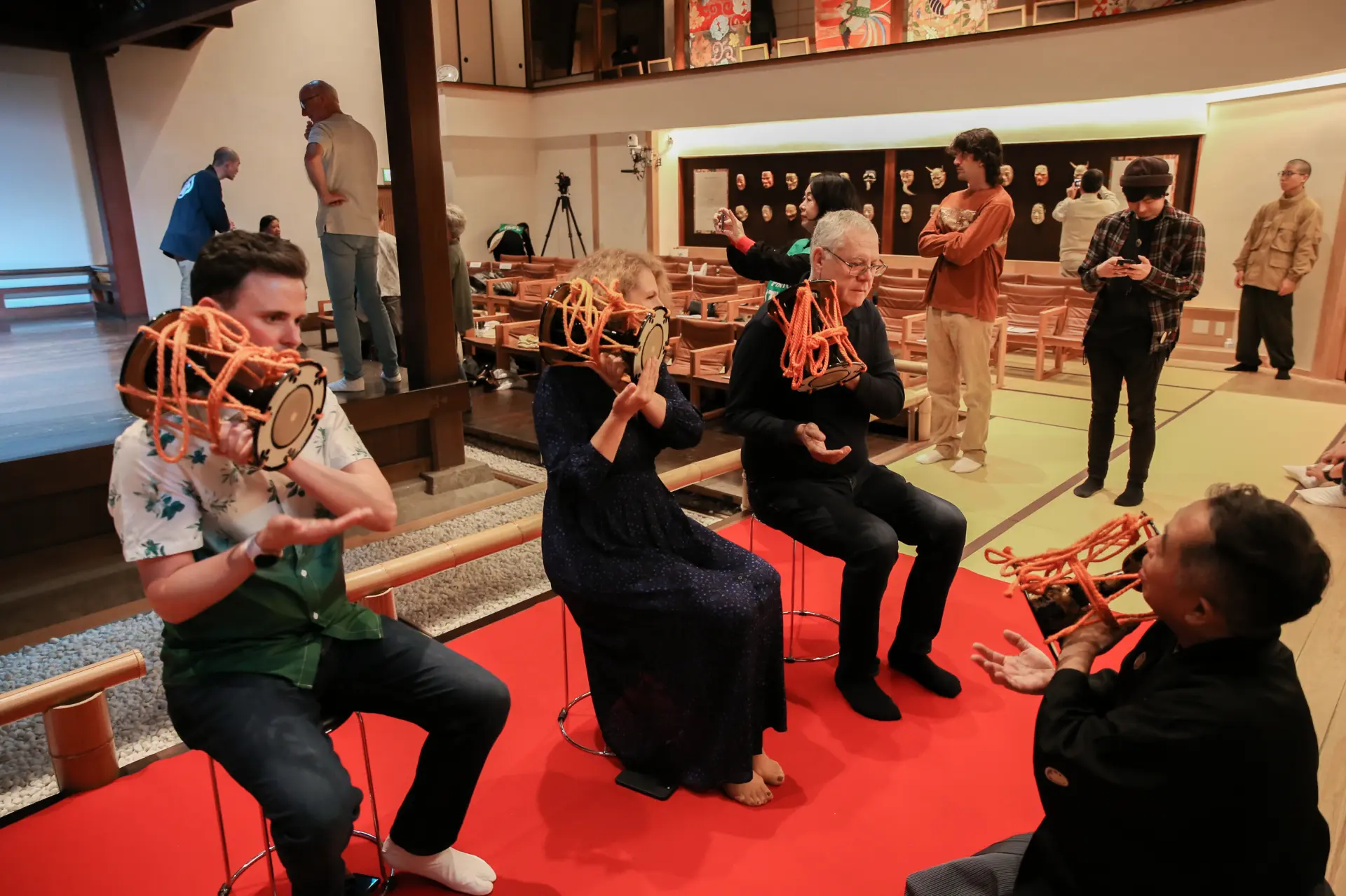 A hands-on experience with the kotsuzumi (small hand drum) under the guidance of a Noh performer