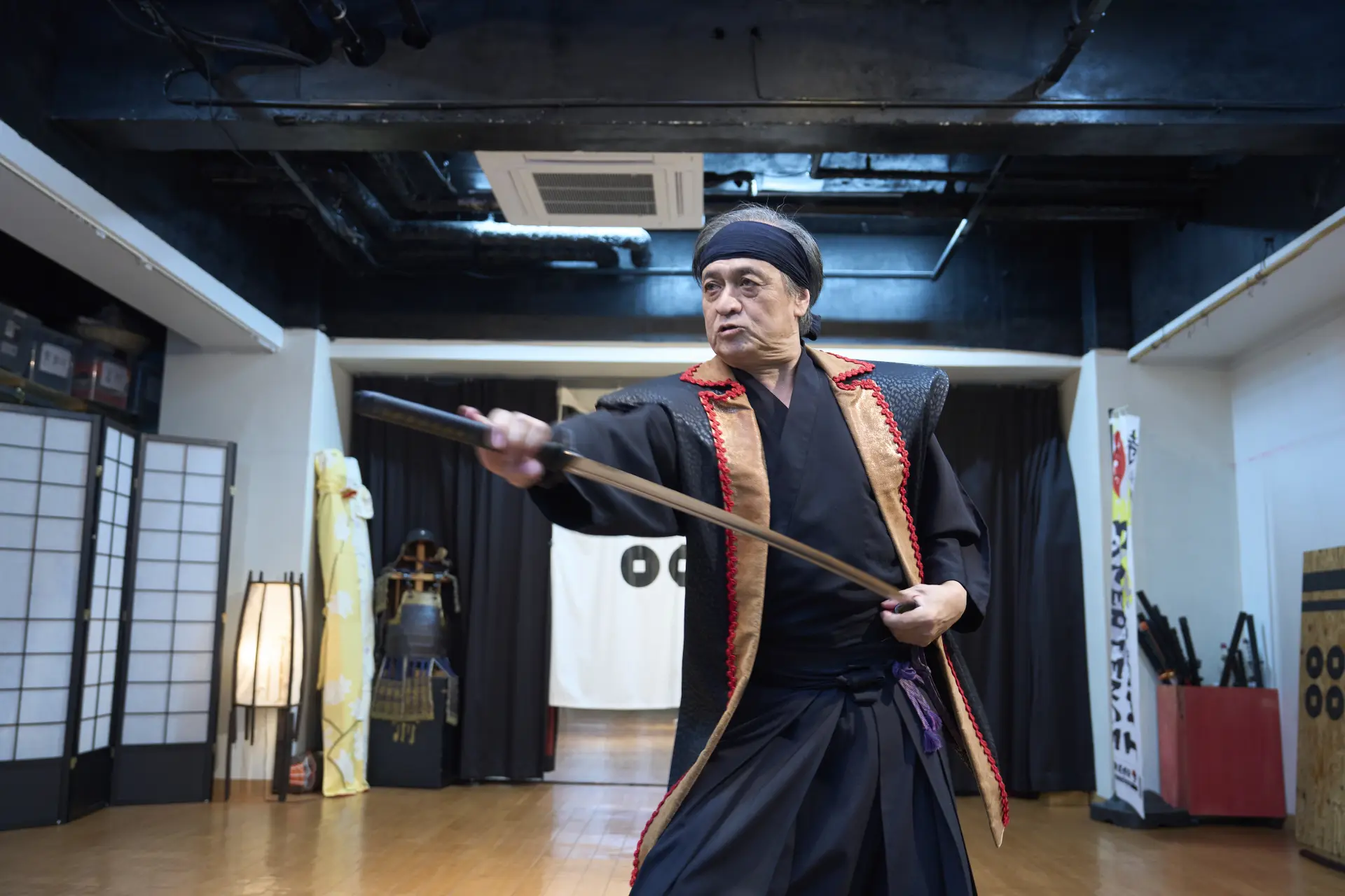 An iai (sword-drawing) performance. The sound of the blade cutting through the air echoes in the silence.