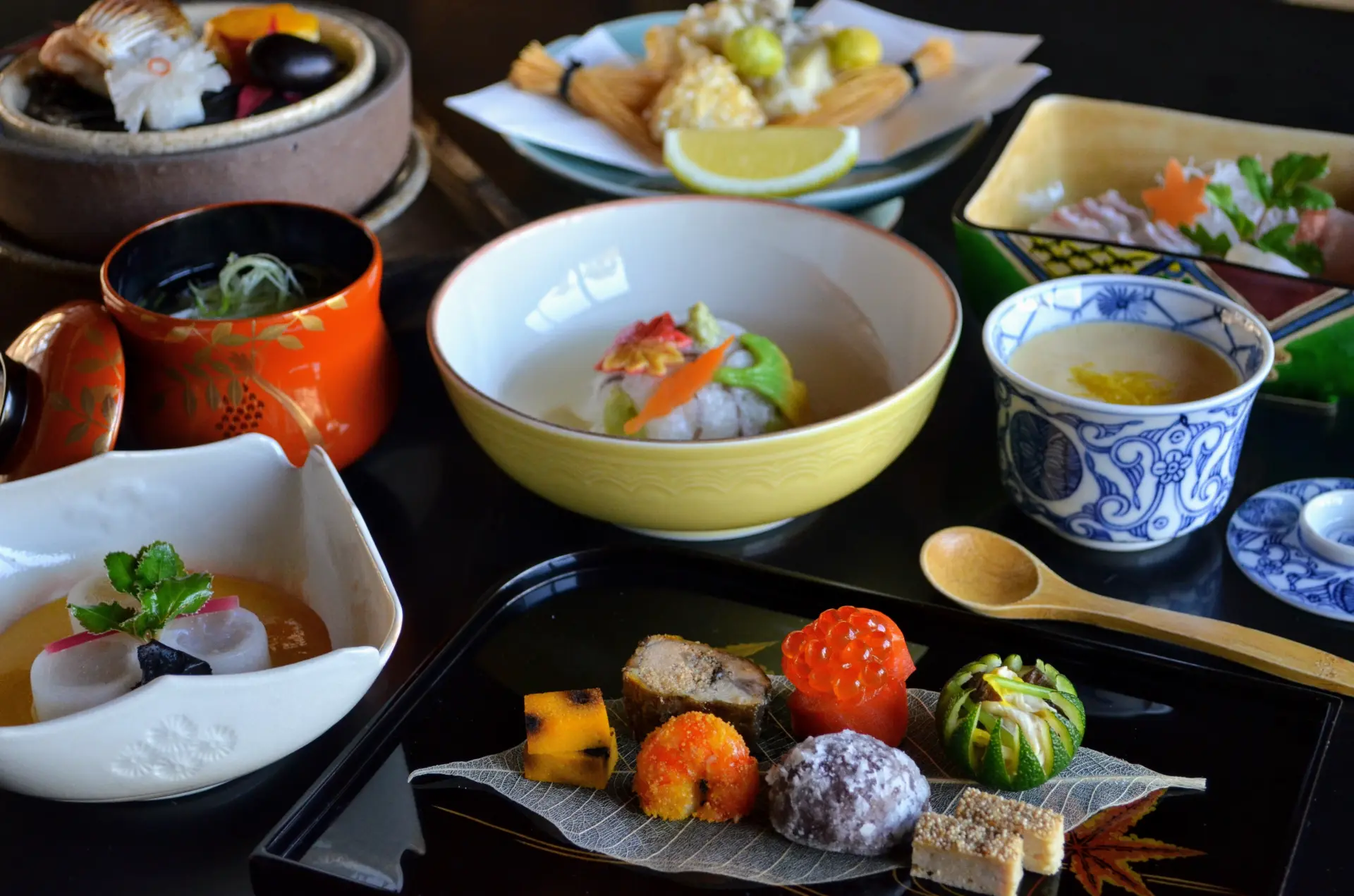 A meticulously arranged kaiseki meal featuring seasonal ingredients