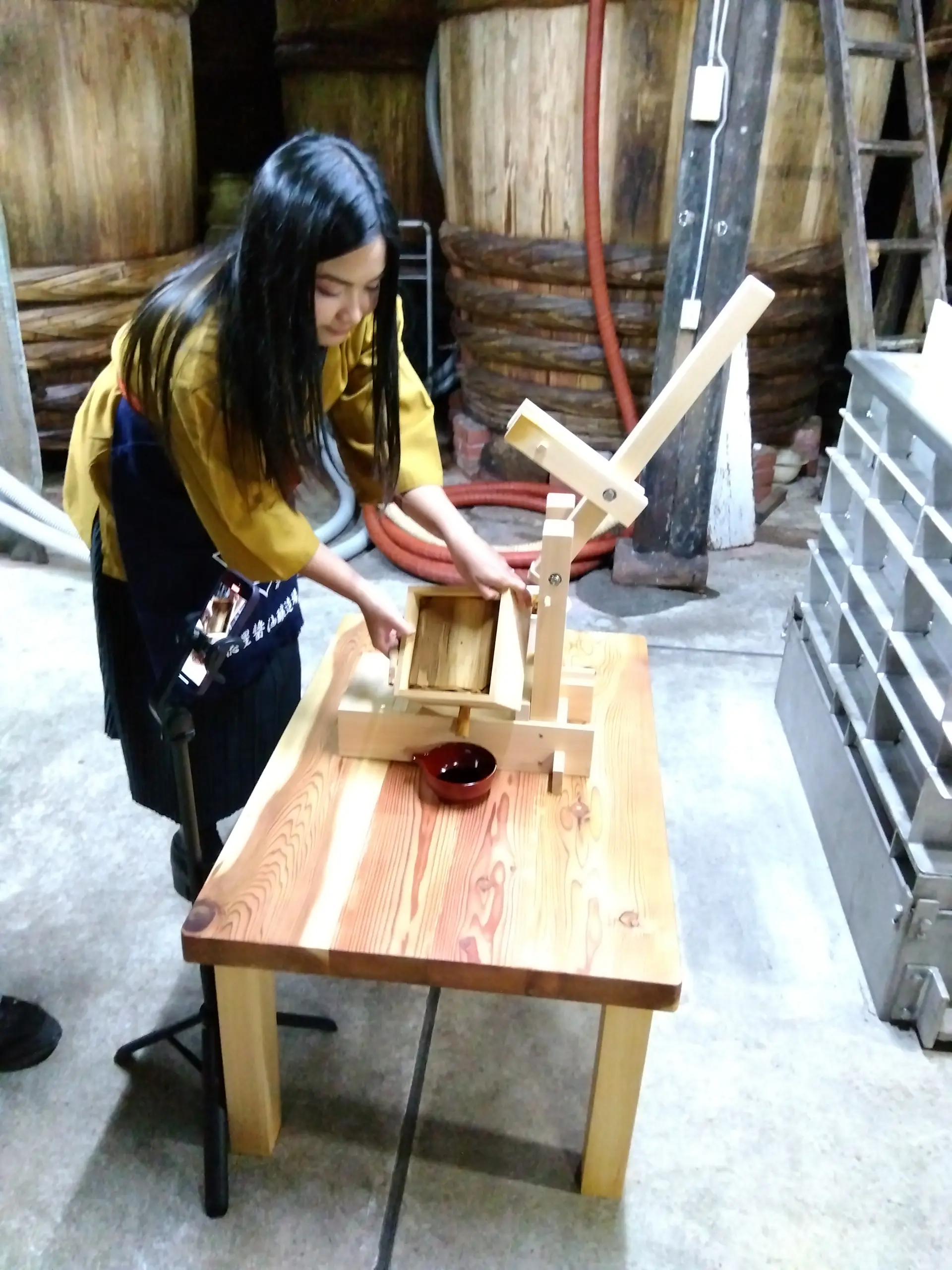 Try soy sauce pressing while dressed in traditional brewery attire.