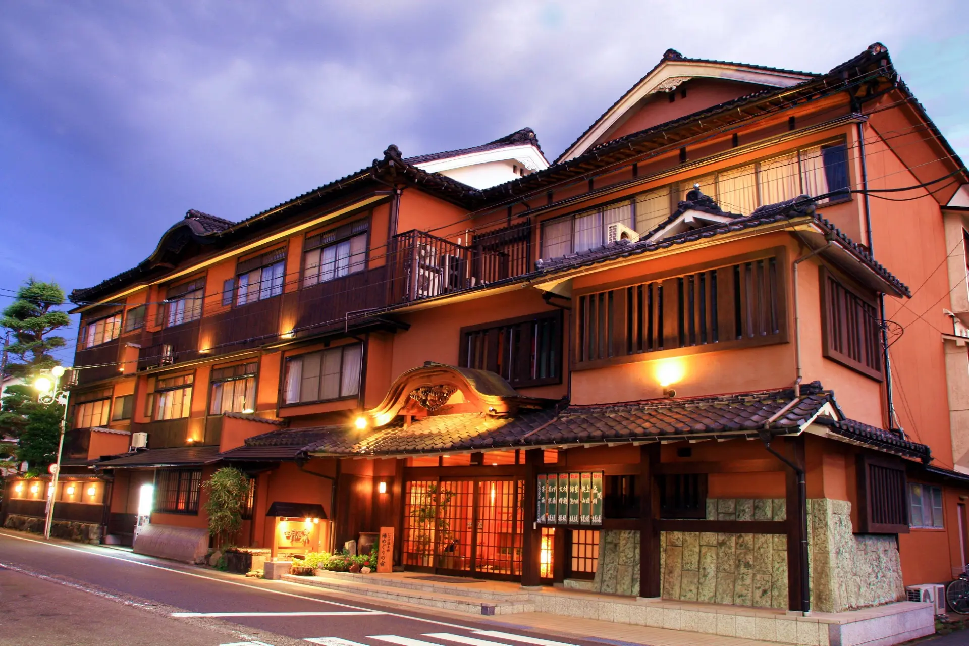 A three-story wooden building, reconstructed in the early Showa era, exuding a nostalgic charm and traditional elegance.