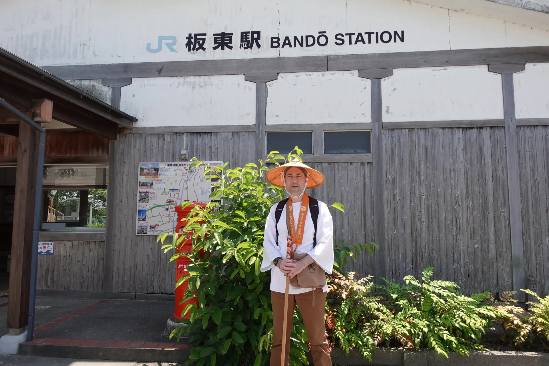 Visiting a sacred temple in traditional Ohenro attire.