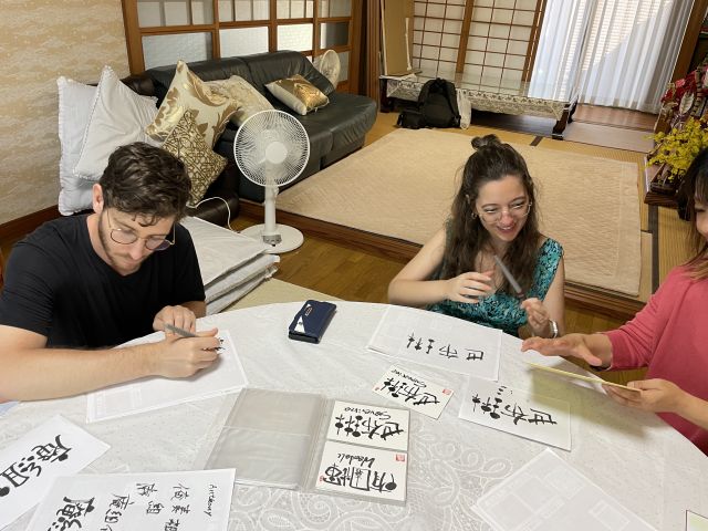 Practice calligraphy with an instructor